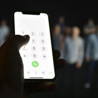 Liberty Bank - Photo of Hand Holding a Smartphone